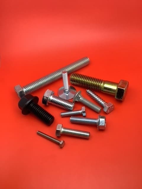 A bunch of different types of metal nuts and bolts