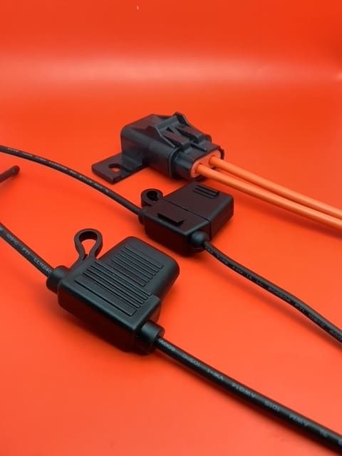 A close up of three different types of wires