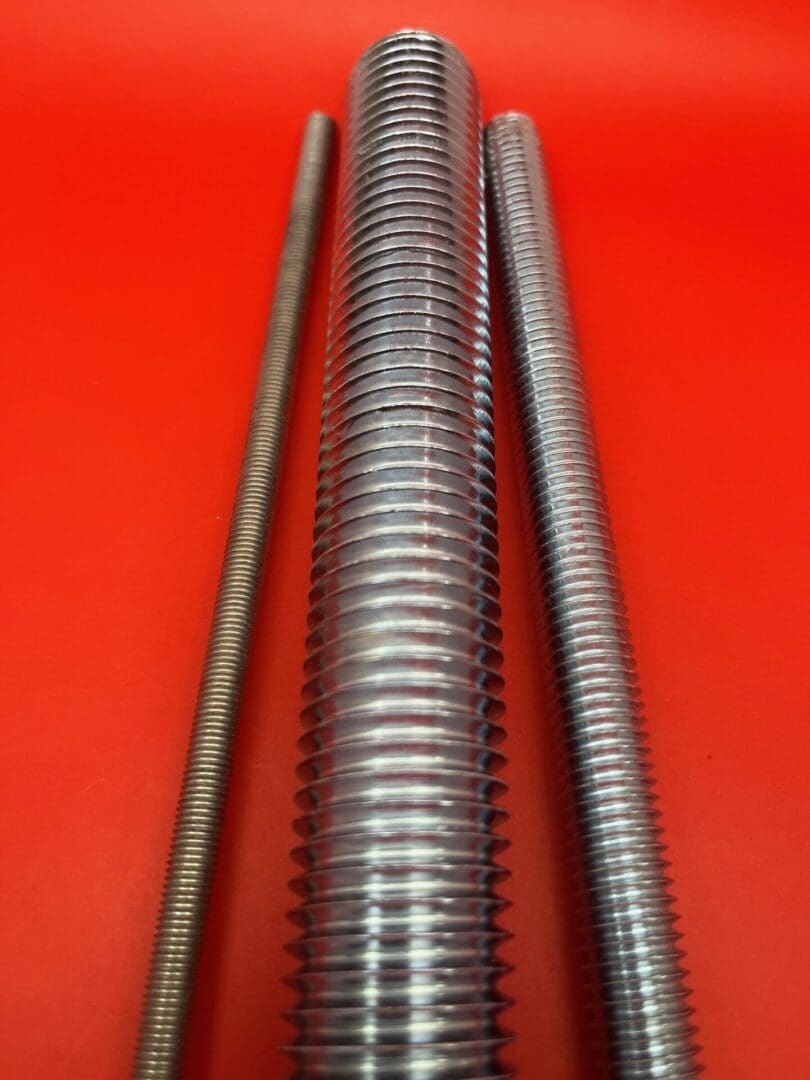 A close up of three different types of metal tubes