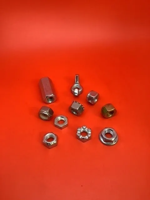 A red table with nuts and bolts on it