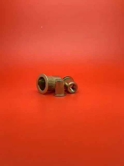 A red table with some small metal objects