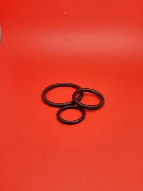 A red table with three black rings on it