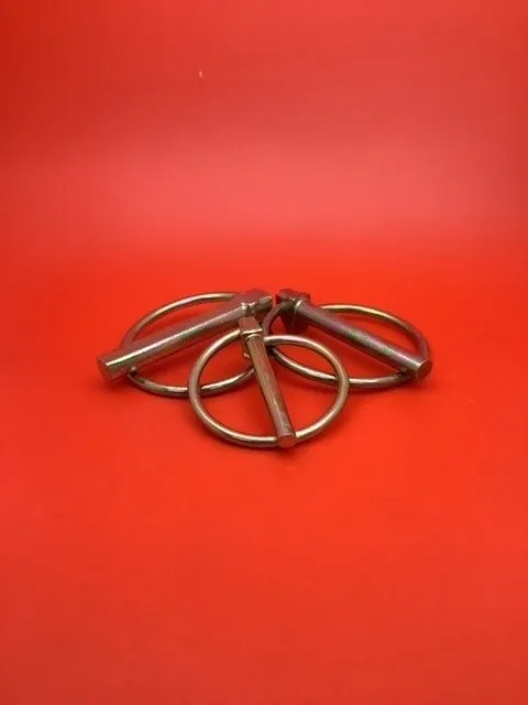 A red table with four metal rings on it