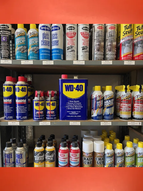 A shelf filled with various cleaning products and supplies.