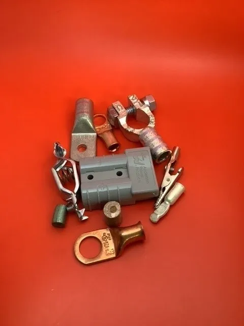 A group of electrical parts sitting on top of a red table.