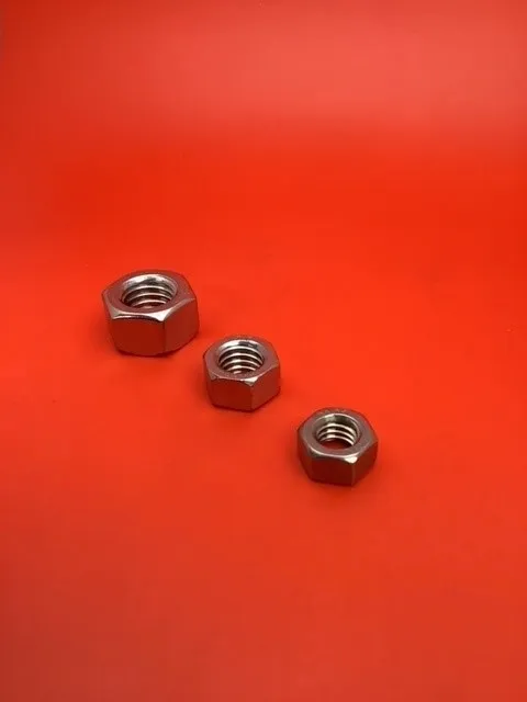 A group of nuts sitting on top of a red table.