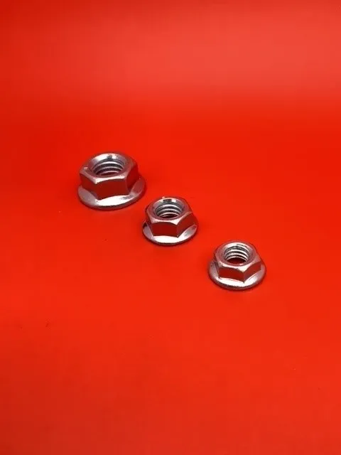 A red table with three nuts on it