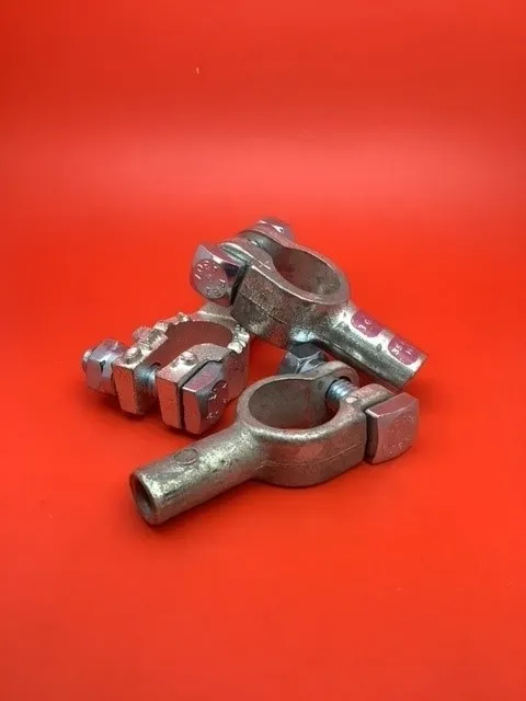 A group of metal parts sitting on top of a red surface.