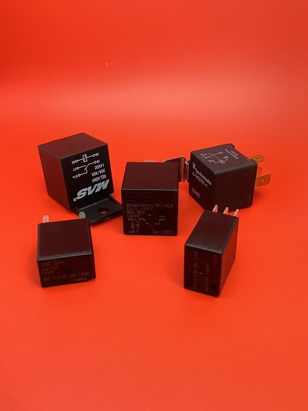 A group of black electrical plugs sitting on top of a table.