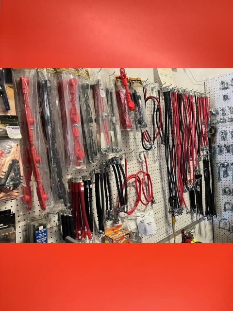 A wall with many different types of tools hanging on it.