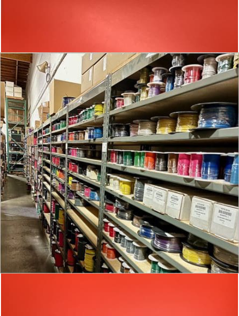 A warehouse filled with lots of shelves full of paint.