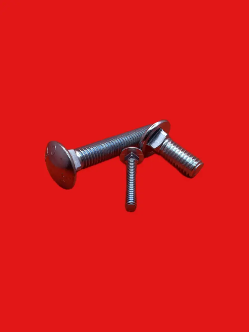 Three metallic bolts on red background.