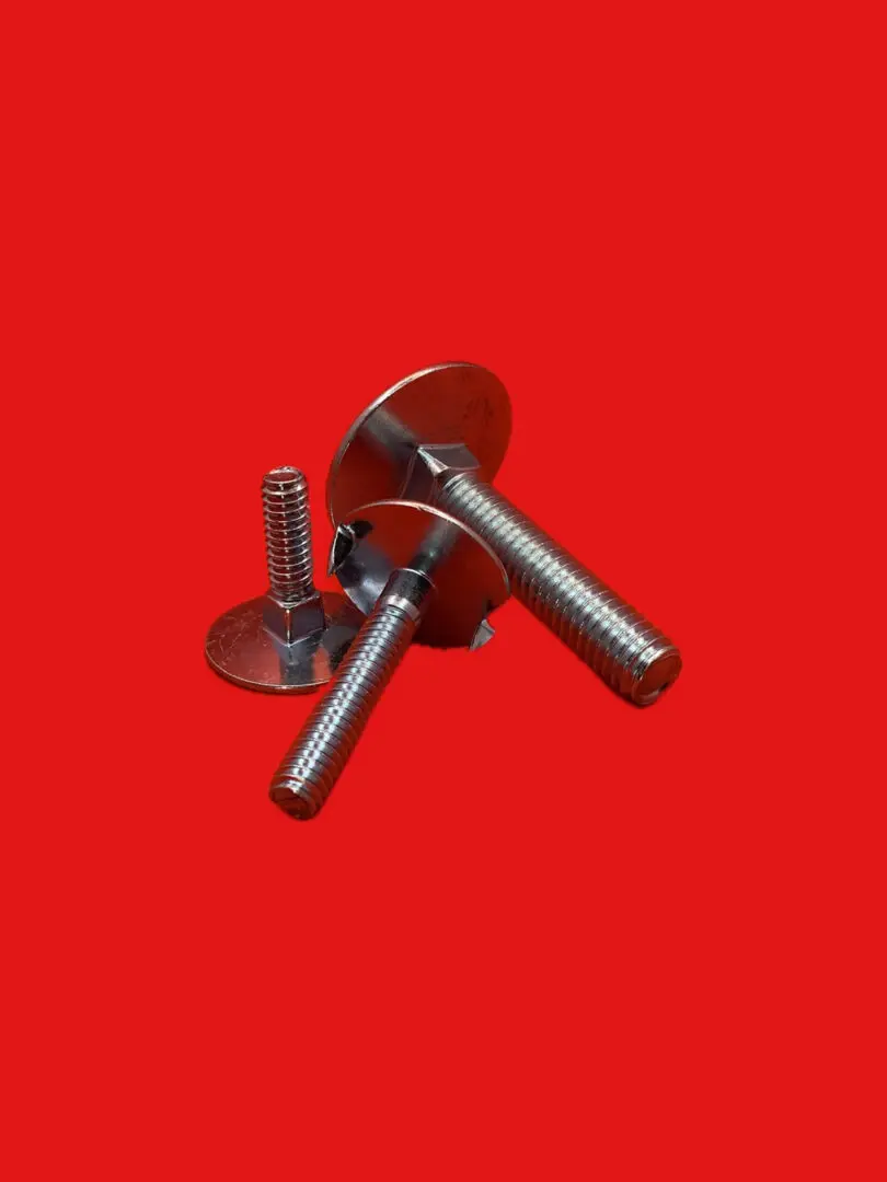 Here's an alt tag for the image: Three metal bolts on red background.